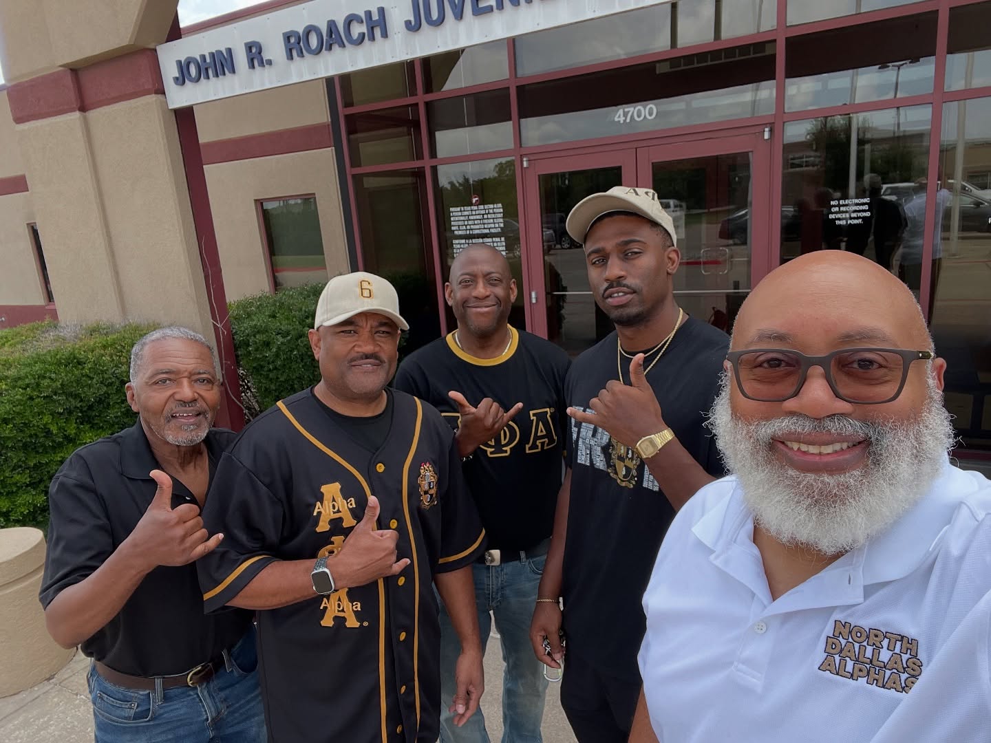 Xi Tau Lambda brothers outside John R. Roach Juvenile Center during a Brother's Keeper mentorship visit