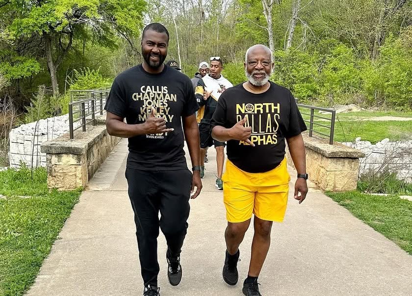 North Dallas Alphas brothers walking together on a nature trail, wearing Alpha Phi Alpha chapter gear