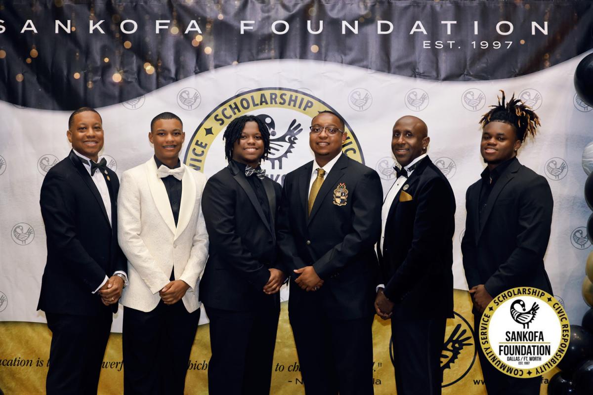 Scholarship recipients and brothers at the gala