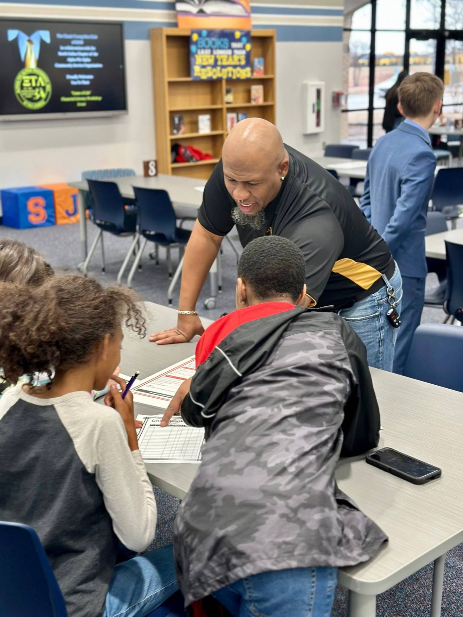 Brother mentoring students representing achievement